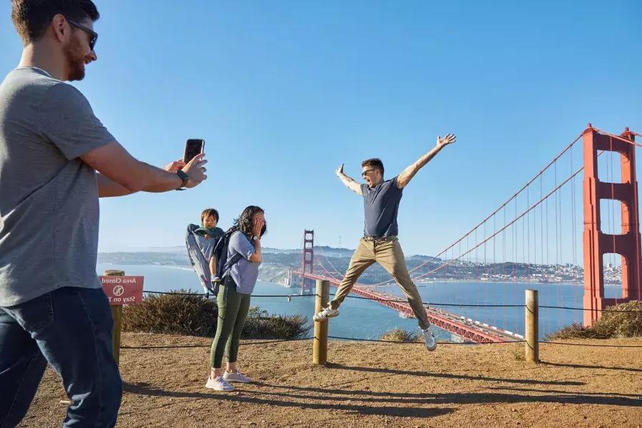 A group taking photos at the Golden Gate Bridge