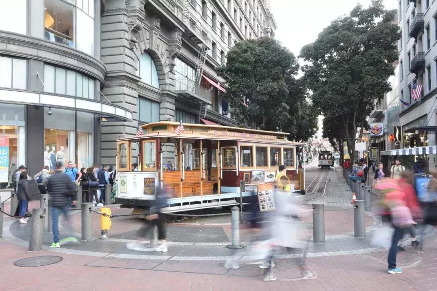 A 贝博体彩app cable car is manually turned at the Powell Cable Car Turnaround.