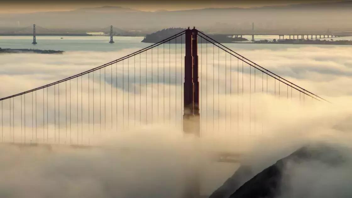 Shot of the Golden Gate Bridge as fog envelops it.